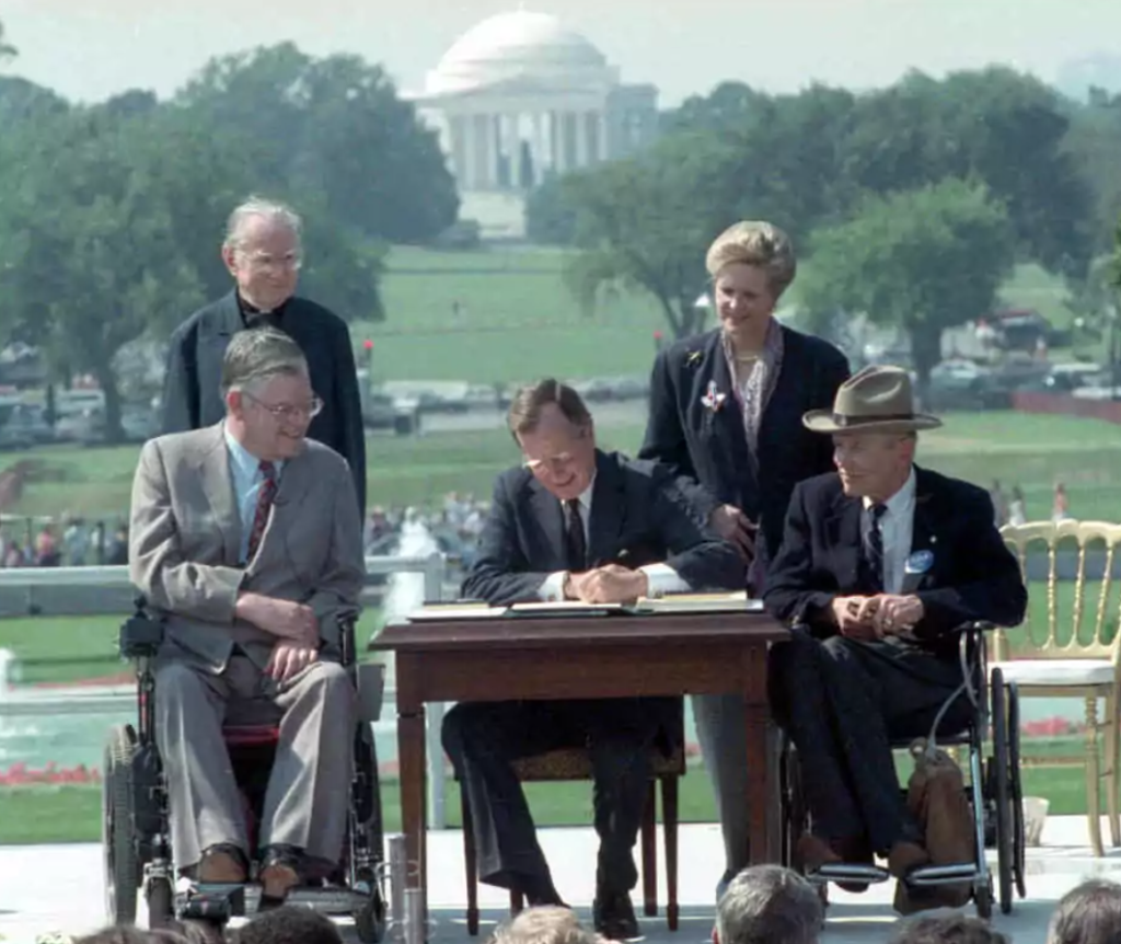 President George H.W. Bush signing the American with Disability Act of 1990.