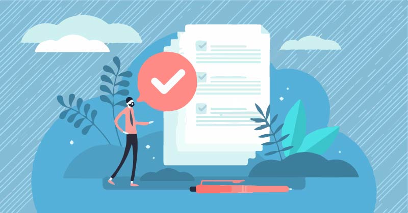 A man looking at a document that has checkmarks of it being validated.